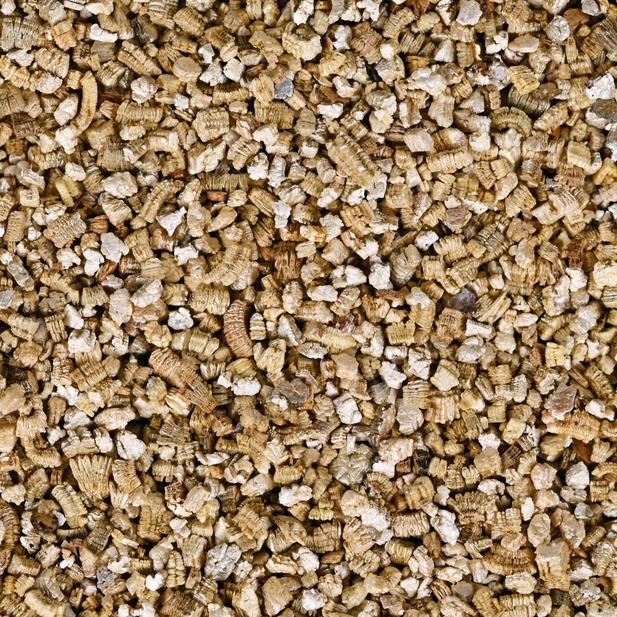 A pile of vermiculite, used for adding to garden soil.